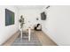 Modern office featuring white walls, contemporary desk, TV, and decor at 418 S Gilpin St, Denver, CO 80209