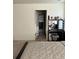 Bright bedroom with a vanity area and a large window at 1109 Sunrise Dr, Lochbuie, CO 80603