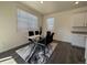 Elegant dining room with glass-top table, black chairs, and stylish area rug at 1109 Sunrise Dr, Lochbuie, CO 80603