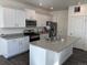Well-equipped kitchen featuring stainless steel appliances, and an island at 1109 Sunrise Dr, Lochbuie, CO 80603