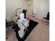 Office space furnished with a modern glass desk and a comfortable chair at 1109 Sunrise Dr, Lochbuie, CO 80603