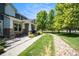 Charming exterior with landscaped front yard and stone facade at 2550 Winding River Dr # E1, Broomfield, CO 80023