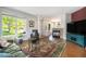 Cozy living room featuring a fireplace, hardwood floors, and lots of natural light at 2550 Winding River Dr # E1, Broomfield, CO 80023
