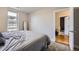 Bedroom with a large window and neutral walls and carpet at 2841 N Columbine St, Denver, CO 80205