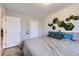 Well-lit bedroom with accent wall decor, comfy carpet, and a large window at 2841 N Columbine St, Denver, CO 80205