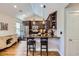 Bright kitchen featuring stainless steel appliances, a granite countertop, and a breakfast bar at 2841 N Columbine St, Denver, CO 80205