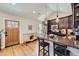 Well-appointed kitchen featuring updated cabinets, stainless appliances, and a convenient center island with seating at 2841 N Columbine St, Denver, CO 80205