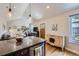 Open-concept living space with kitchen island, hardwood floors, and plenty of natural light at 2841 N Columbine St, Denver, CO 80205