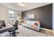 A comfortable office space has plenty of natural light, a sleek desk, and room to relax at 2841 N Columbine St, Denver, CO 80205