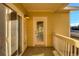 Cozy outdoor balcony with sliding glass doors, offering a view of the neighborhood at 9335 Amison Cir # 203, Parker, CO 80134
