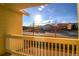 Balcony view of a suburban street on a sunny day, promising peaceful living at 9335 Amison Cir # 203, Parker, CO 80134