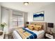 Inviting bedroom with a large window, stylish decor, and a comfortable bed for relaxing at 9335 Amison Cir # 203, Parker, CO 80134
