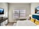 Bright bedroom featuring modern decor, a large window, wood floors, and a plush rug at 9335 Amison Cir # 203, Parker, CO 80134