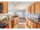 Well-lit kitchen offering sleek appliances, granite counters, and an open design to the adjacent dining space at 9335 Amison Cir # 203, Parker, CO 80134