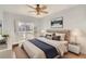 Cozy bedroom with a sliding glass door to a balcony, a ceiling fan, and a calming atmosphere at 9335 Amison Cir # 203, Parker, CO 80134