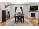 Dining room with hardwood floors and a view into the living room at 20150 E Fair Ln, Centennial, CO 80016