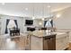 Modern kitchen island with seating overlooking the dining room at 20150 E Fair Ln, Centennial, CO 80016