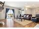 Living room with hardwood floors, fireplace, and sliding glass doors at 20150 E Fair Ln, Centennial, CO 80016