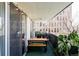 Relaxing balcony featuring green carpet, cafe lights, and a picnic table with bench at 909 N Logan St # 3A, Denver, CO 80203