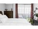 Bedroom with a bed and sliding glass door to a balcony at 909 N Logan St # 3A, Denver, CO 80203