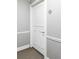 Hallway door with trim, baseboards, and a metallic silver letter A sign above at 909 N Logan St # 3A, Denver, CO 80203