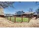 Large backyard with wood fence, wooden deck with outdoor seating, and space for RV parking at 13915 W 73Rd Ave, Arvada, CO 80005
