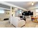 The basement includes a living area, exercise equipment, and entertainment system at 13915 W 73Rd Ave, Arvada, CO 80005