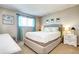 Bright bedroom features a neutral color scheme and plenty of natural light at 13915 W 73Rd Ave, Arvada, CO 80005