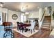 Bright dining room with hardwood floors, stylish lighting, and easy access to the kitchen at 13915 W 73Rd Ave, Arvada, CO 80005