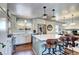 Bright kitchen featuring stainless steel appliances, a large island, and plenty of natural light at 13915 W 73Rd Ave, Arvada, CO 80005