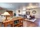 Open-concept living area seamlessly connects the living room, dining area, and kitchen at 13915 W 73Rd Ave, Arvada, CO 80005
