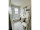 Updated bathroom with modern vanity, patterned tile floor, and tiled shower and tub at 1170 Elmira St, Aurora, CO 80010