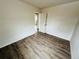 Spacious bedroom featuring hardwood flooring, neutral wall color and a connecting closet at 1170 Elmira St, Aurora, CO 80010