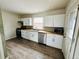 Modern kitchen with stainless steel appliances, new cabinets, and beautiful countertop and backsplash at 1170 Elmira St, Aurora, CO 80010