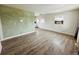 Spacious living room with hardwood flooring, light walls, and ample natural light from the windows at 1170 Elmira St, Aurora, CO 80010