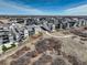 Bird's eye view of a gray home showing backyard landscaping, a trail, and surrounding neighborhood at 6977 Copper Sky Cir, Castle Pines, CO 80108