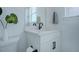 Bathroom with white vanity and dark hardware with white walls and neutral accents at 6977 Copper Sky Cir, Castle Pines, CO 80108