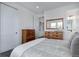 Cozy bedroom with a comfortable bed and modern decor with neutral accents at 6977 Copper Sky Cir, Castle Pines, CO 80108