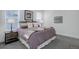 Bedroom featuring soft natural light, neutral decor, and plush carpeting at 6977 Copper Sky Cir, Castle Pines, CO 80108