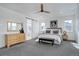 Bright bedroom features a ceiling fan, multiple windows, neutral walls, carpeting, and simple furnishings at 6977 Copper Sky Cir, Castle Pines, CO 80108