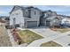Two-story home with a two-car garage and landscaped front yard at 6977 Copper Sky Cir, Castle Pines, CO 80108