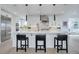 Modern kitchen with quartz countertops and stainless steel appliances at 6977 Copper Sky Cir, Castle Pines, CO 80108