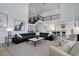 Bright living room with open floor plan to the gourmet kitchen at 6977 Copper Sky Cir, Castle Pines, CO 80108