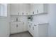 Spacious mud room featuring ample cabinet and countertop space with modern black hardware at 6977 Copper Sky Cir, Castle Pines, CO 80108