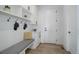 Mudroom boasts a convenient bench with storage, coat hooks, and bright white trim at 6977 Copper Sky Cir, Castle Pines, CO 80108