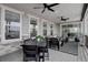 Inviting covered patio with an outdoor dining area, lounge furniture, and modern finishes for entertaining at 6977 Copper Sky Cir, Castle Pines, CO 80108