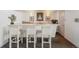 Stylish bar area featuring seating, shelving, decorative art, and ample counter space, ideal for entertaining guests at 252 N Pennsylvania St # 102, Denver, CO 80203