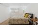 Comfortable bedroom with a large window letting in natural light, desk area, and neutral decor, creating a calming space at 252 N Pennsylvania St # 102, Denver, CO 80203