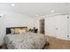 Cozy bedroom features neutral tones, carpeted floor, closet and small work area, perfect for relaxing and unwinding at 252 N Pennsylvania St # 102, Denver, CO 80203