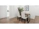 Cozy dining area with modern table, chairs, sleek lighting and easy access to other rooms at 252 N Pennsylvania St # 102, Denver, CO 80203